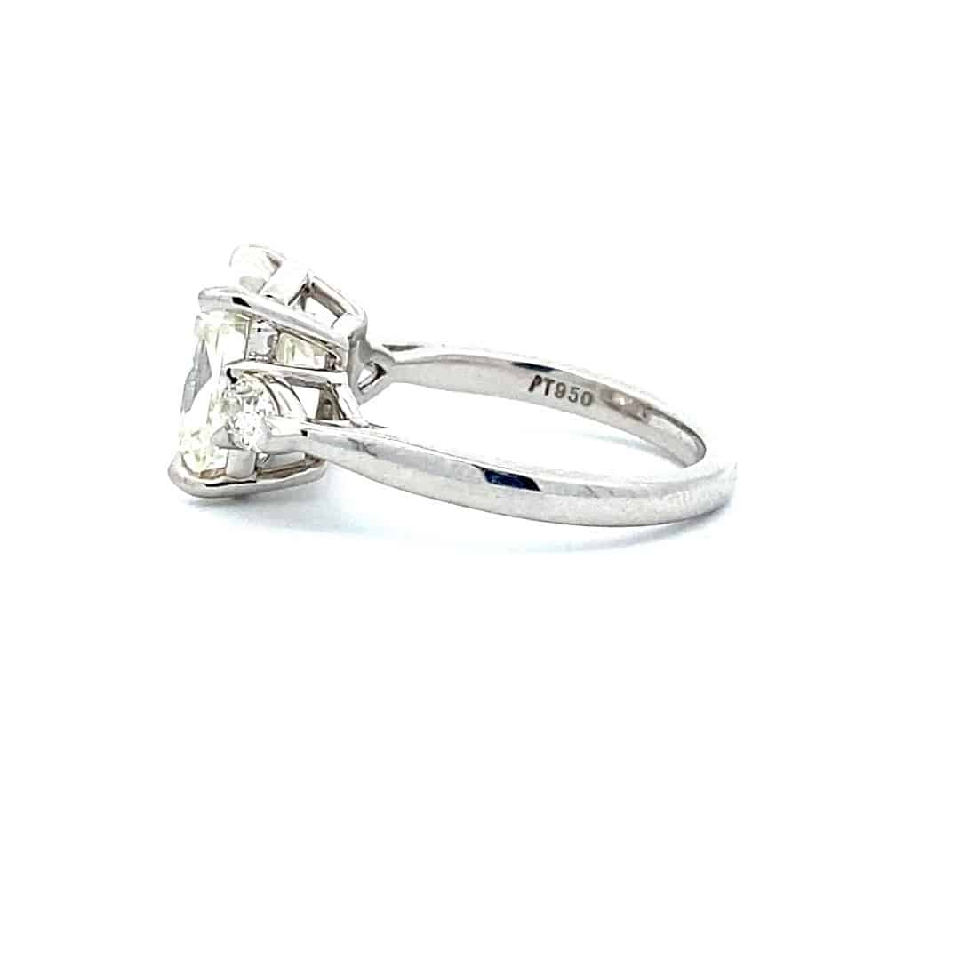 Radiant and Pear Three-Stone Diamond Engagement Ring in Platinum