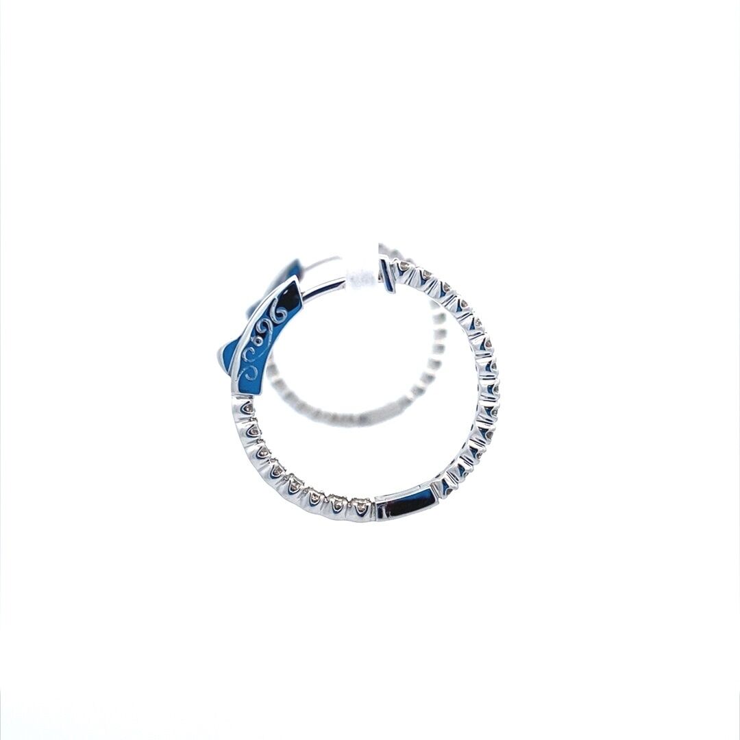 A pair of round-shaped gold diamond hoop earrings