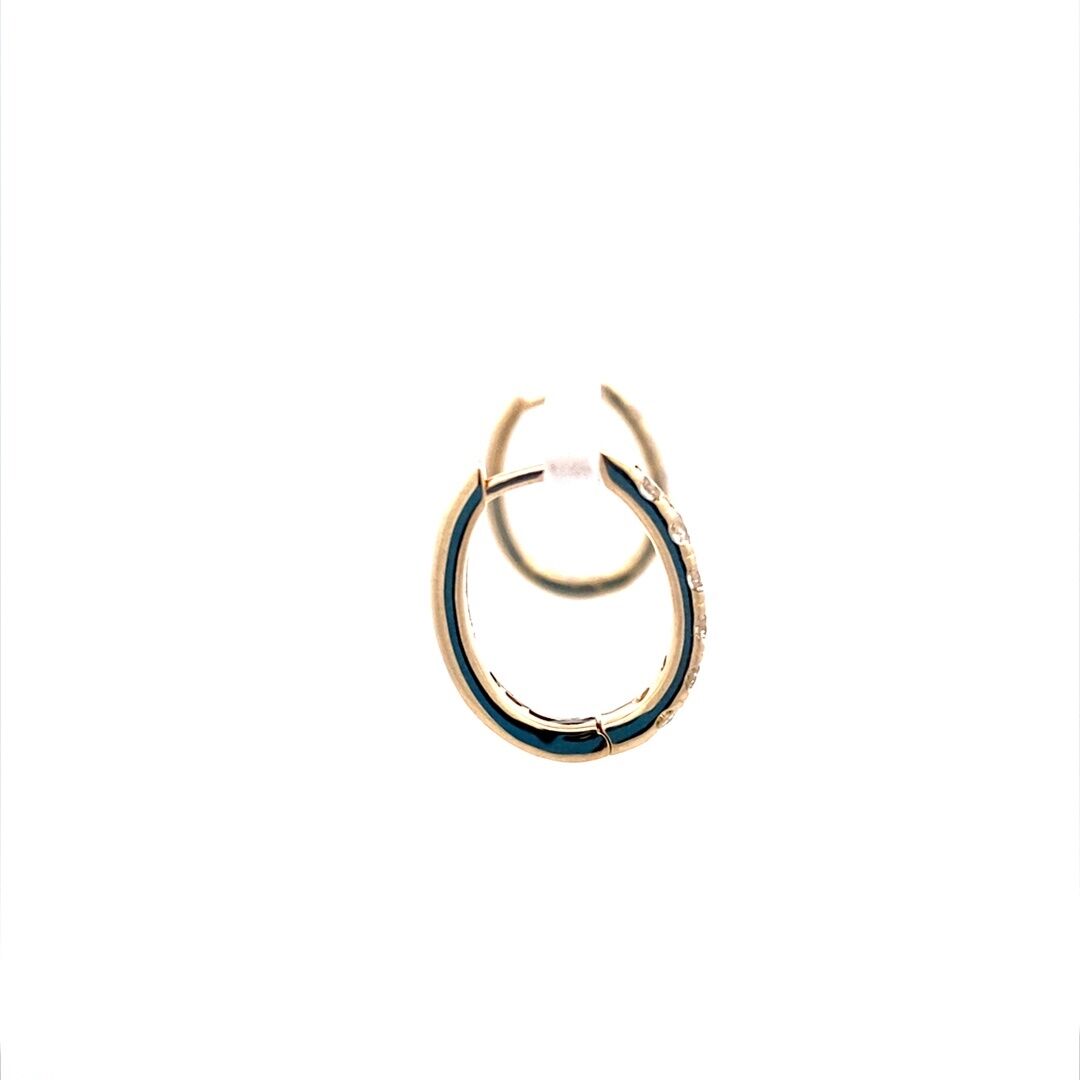 A pair of oval-shaped gold diamond hoop earrings