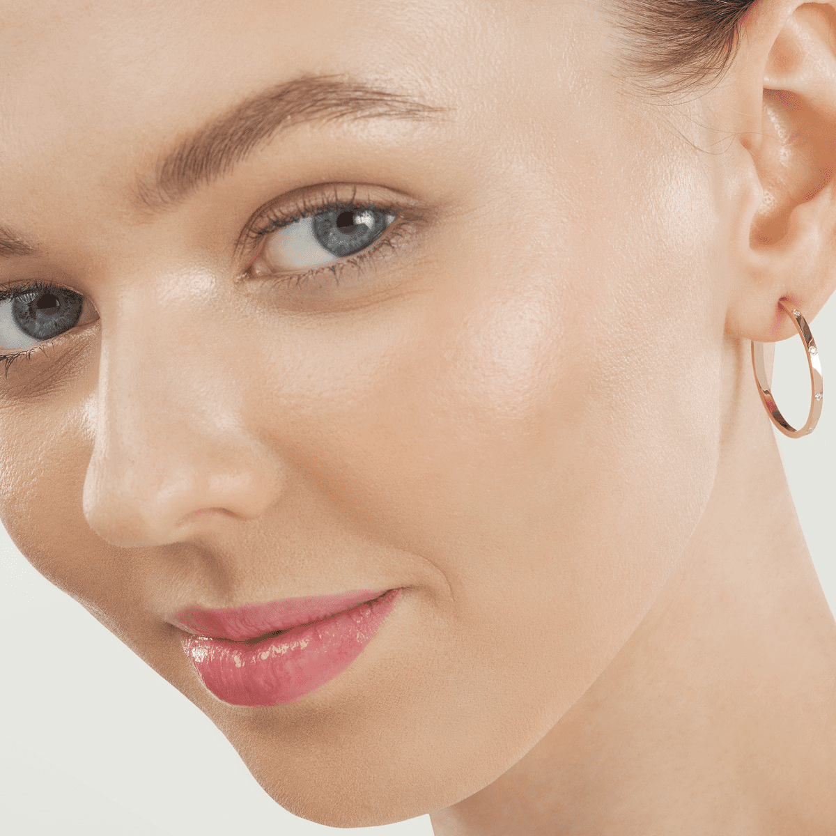 A pair of yellow gold square tube hoop earrings flush set with round diamonds