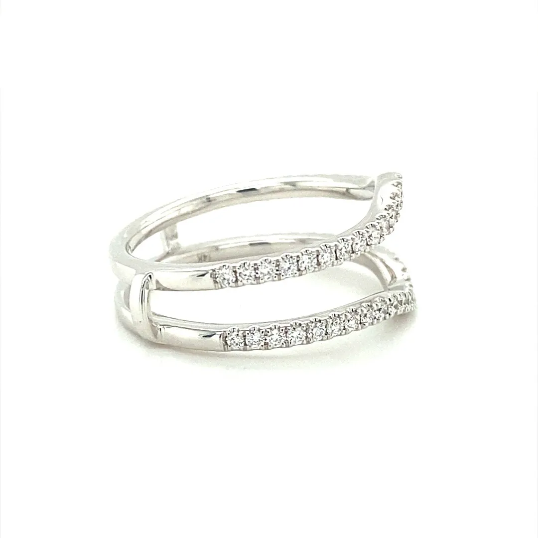 One (1) 14 karat white gold and diamond ring guard featuring fifty-four (54) round brilliant diamonds weighing 0.45 carats total weight with matching G-H color and VS2-SI1 clarity, prong-set in a curved fitted style ring guard with two shanks connected at the bottom. The ring guard is open to be able to insert a ring in between the two curved shanks. The ring is a finger size 7.5.