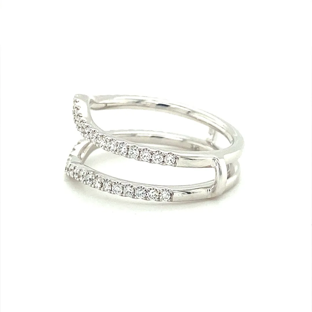 One (1) 14 karat white gold and diamond ring guard featuring fifty-four (54) round brilliant diamonds weighing 0.45 carats total weight with matching G-H color and VS2-SI1 clarity, prong-set in a curved fitted style ring guard with two shanks connected at the bottom. The ring guard is open to be able to insert a ring in between the two curved shanks. The ring is a finger size 7.5.