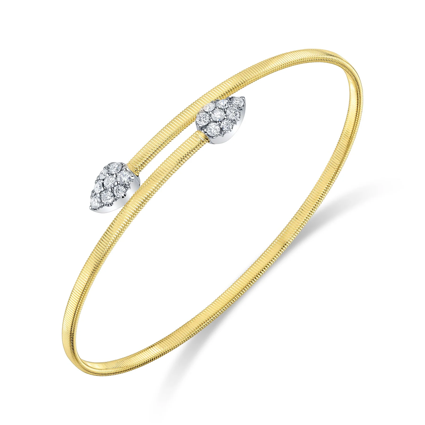 A two-tone gold bypass cuff bracelet containing round-faceted diamonds weighing 0.44 carat total weight in pear-shaped finials