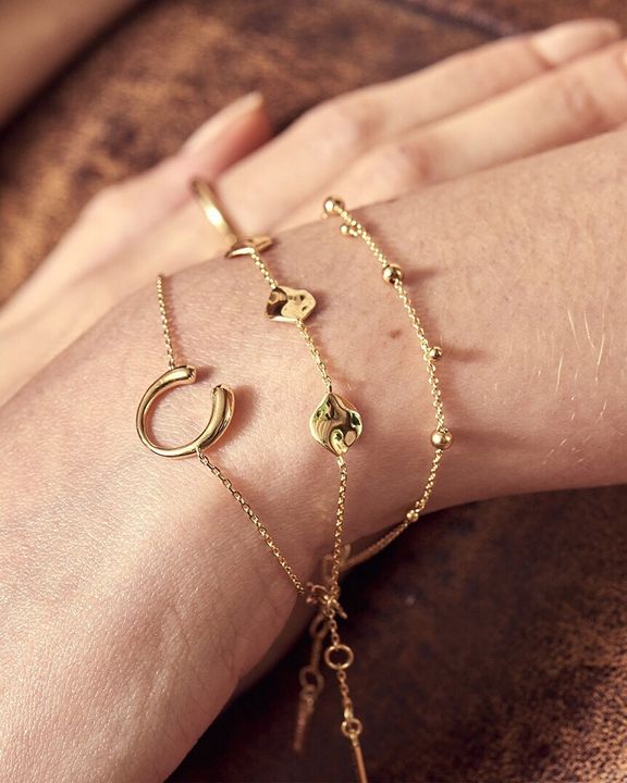 modern drop balls bracelet stacked on model