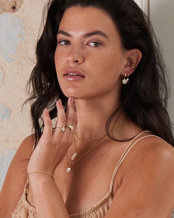 Compass Emblem Huggie Hoops on Model
