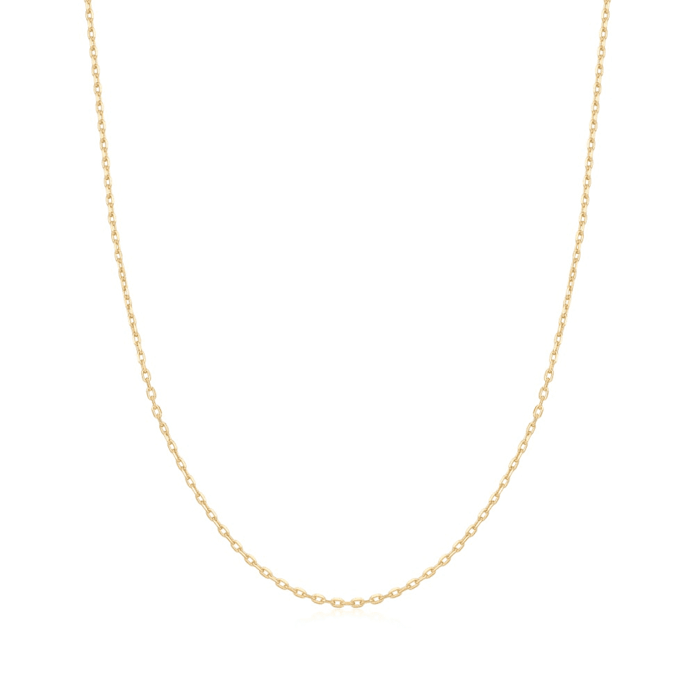 A gold-plated mini link chain necklace set against a white background. From the Pop Charms Collection by Ania Haie