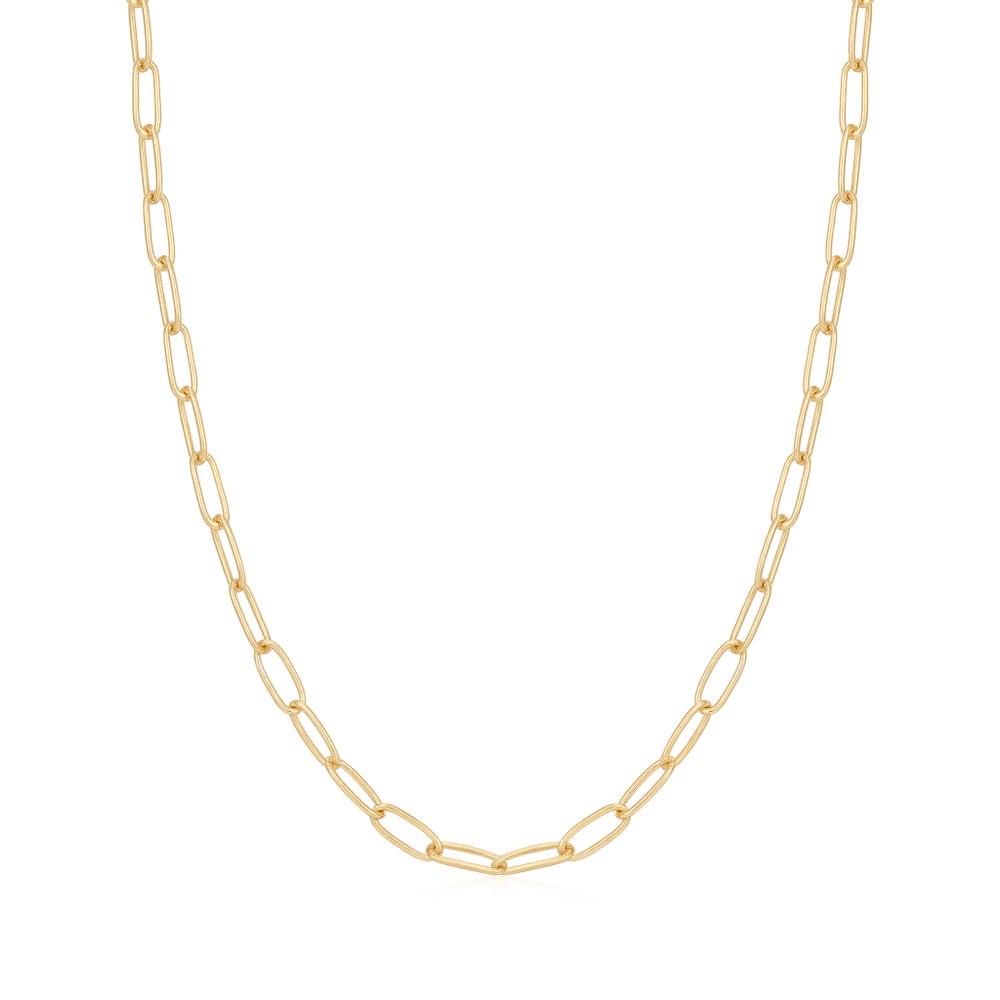 A gold-plated paperclip link chain necklace set against a white background. From the Pop Charms Collection by Ania Haie