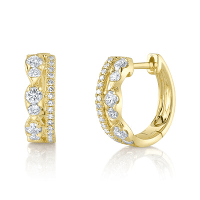 A pair of 14 karat yellow gold hoop earrings with a regal crown motif set with diamonds
