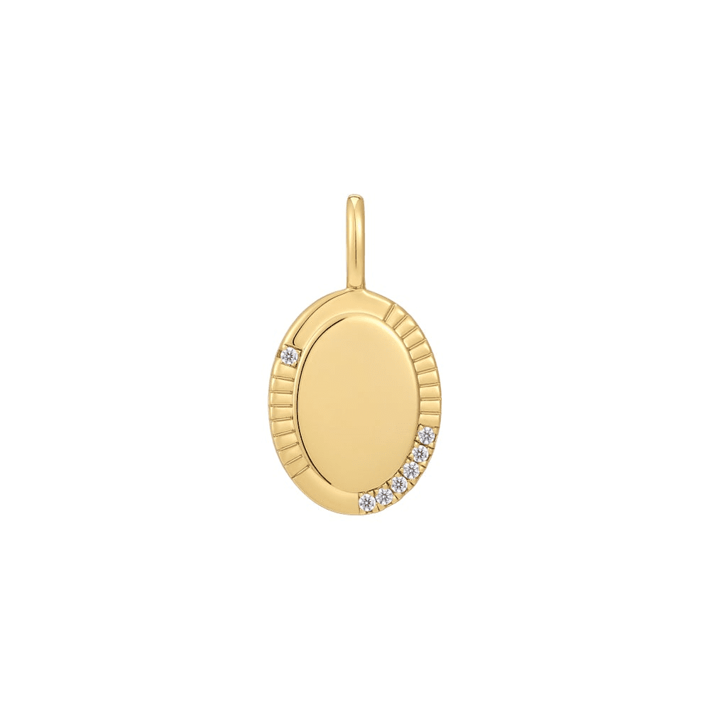 An oval-shaped gold-plated charm from the Pop Charms collection by Ania Haie featuring a border partially set with a ridged pattern and cubic zirconia